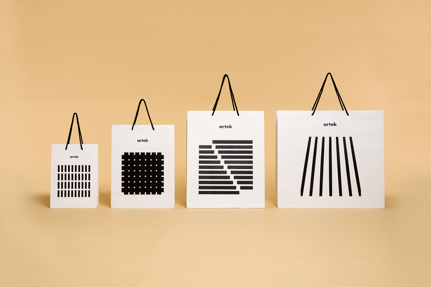 Brand identity and shopping bags by graphic design studio Tsto for furniture and homeware store Artek Helsinki.