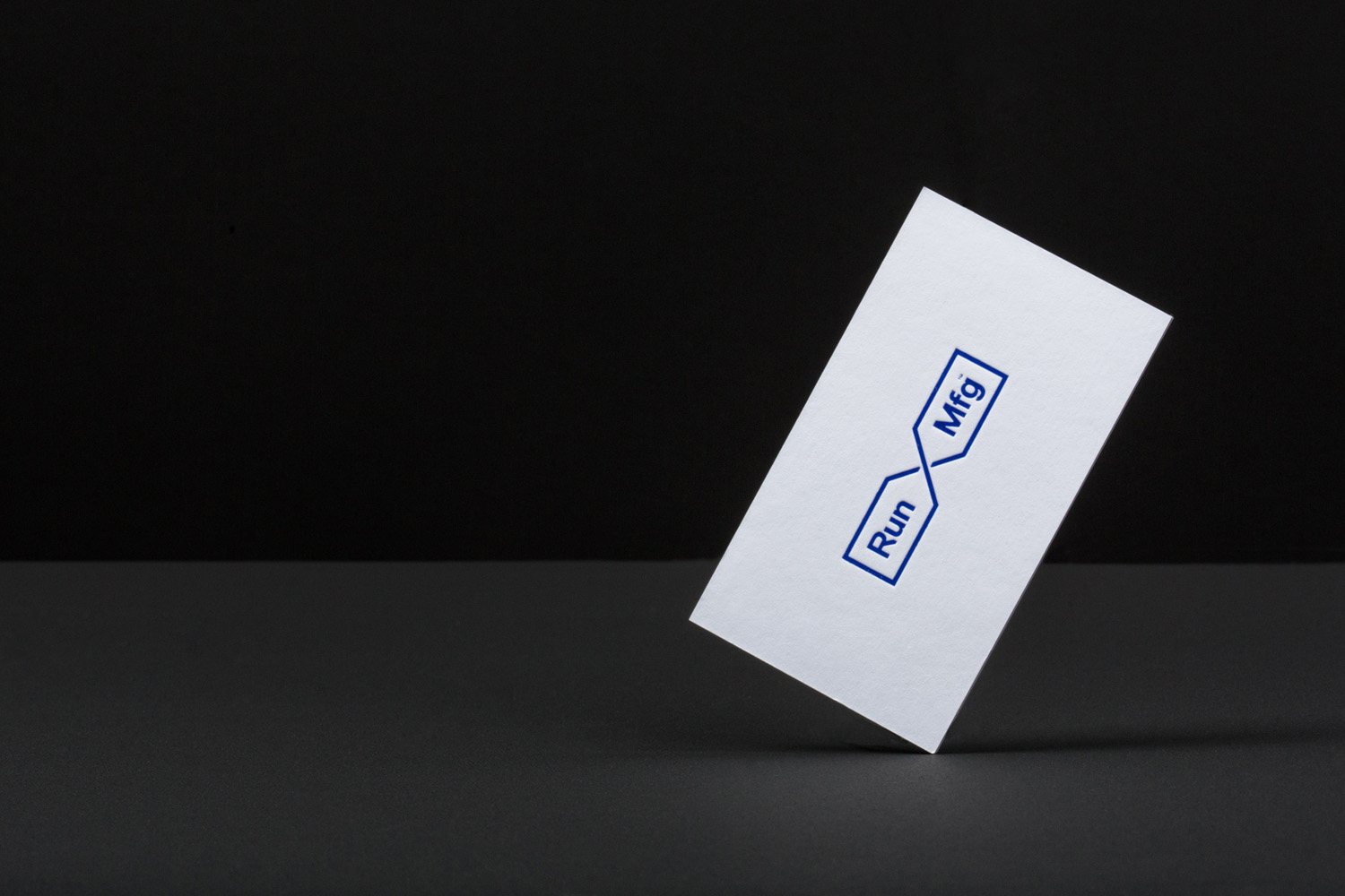 Logo and business cards by Perky Bros for Chicago-based independent race design and production company Run Mfg