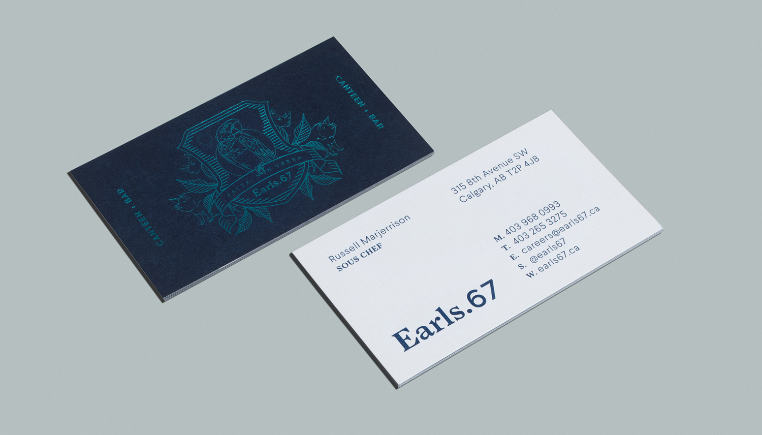 Brand identity and business cards with blue block foil print finish by Glasfurd & Walker for US and Canadian restaurant chain prototype Earls.67