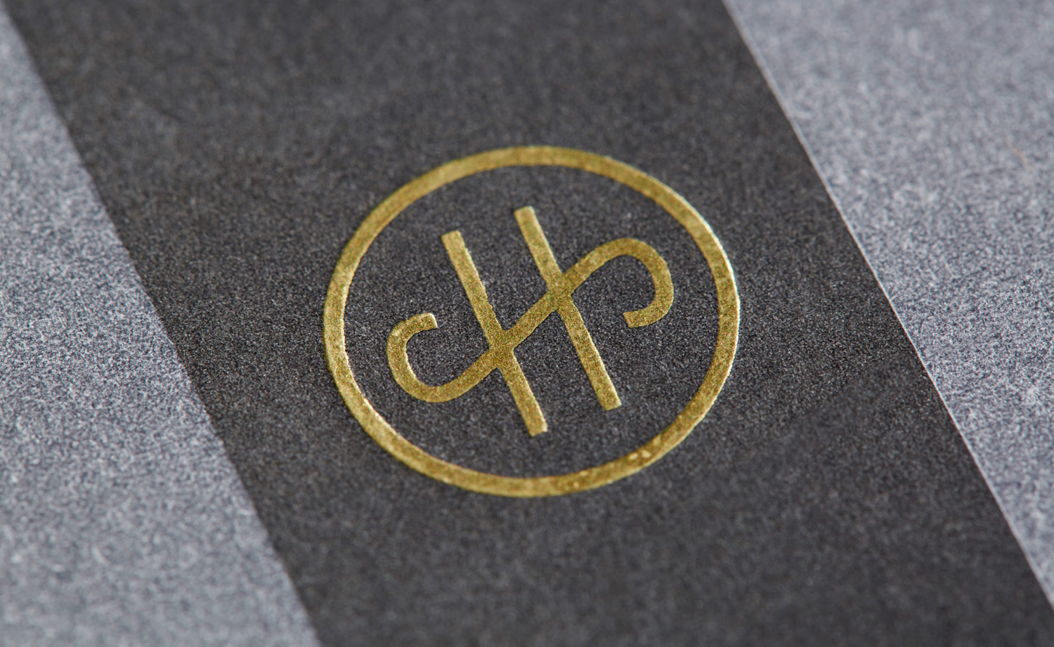Gold foiled monogram by Conductor for High Street Wine Co, a wine bar and shop located in San Antonio's Pearl neighbourhood