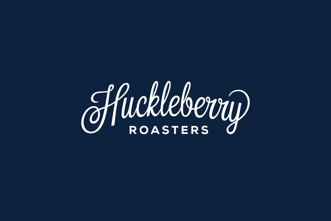 Hand drawn script logotype for Colorado coffee roaster Huckleberry by Mackey Saturday