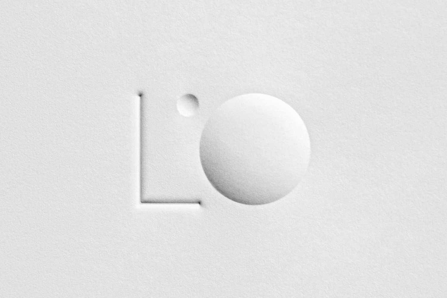 Emboss and deboss logo for lighting specialists L'Observatoire International by New York based design studio Triboro