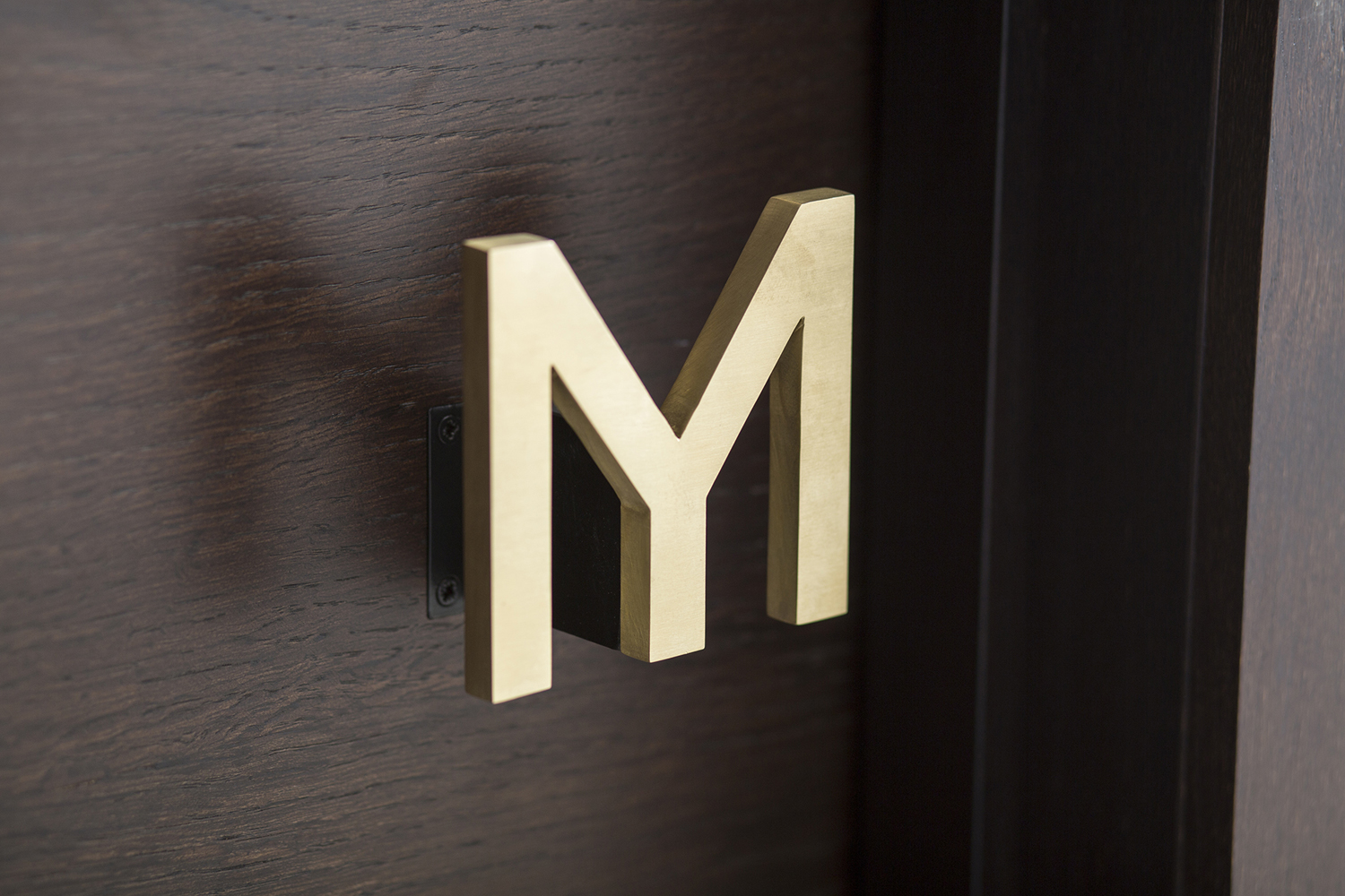 Logo as door handle designed by Bibliothèque for Monica Galetti's new London restaurant Mere