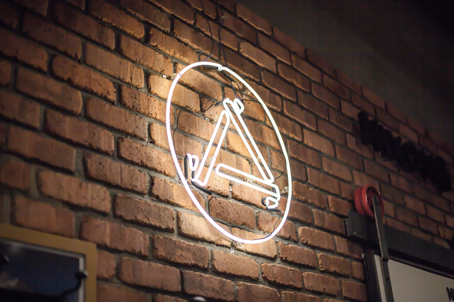 Logo and neon sign by Bravo for Singapore based men's retail store and coffee shop The Assembly