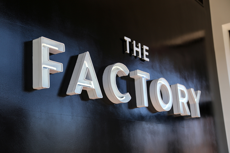 Logotype and signage for fashion store The Factory by graphic design studio Ghost