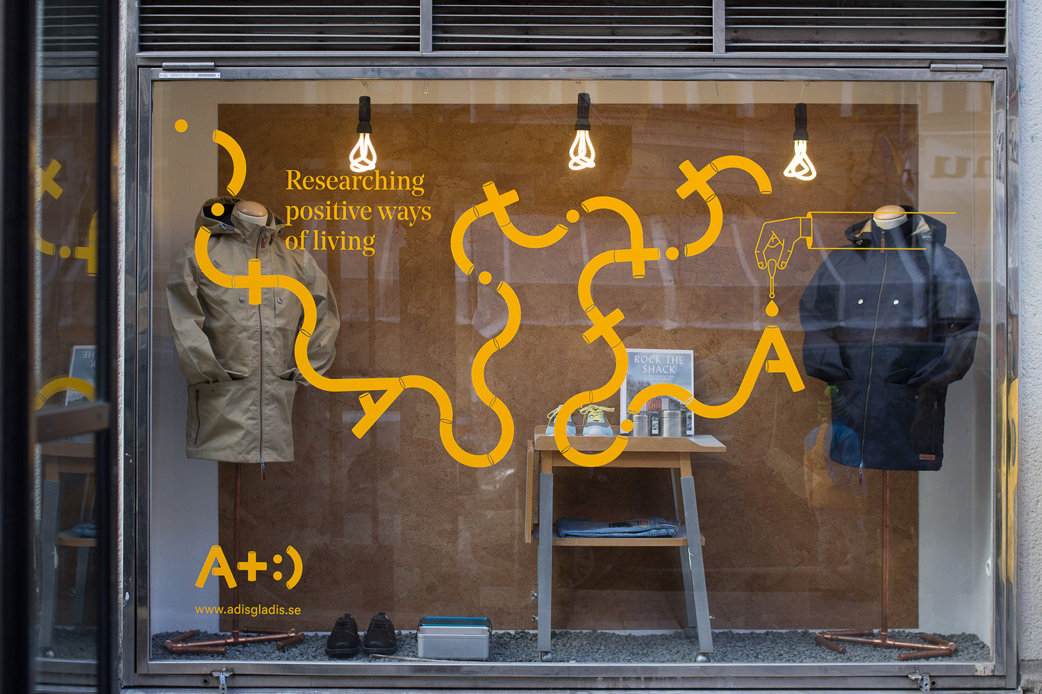 Visual identity and widow decals designed by Bedow for Swedish clothing and gadget retailer Adisgladis