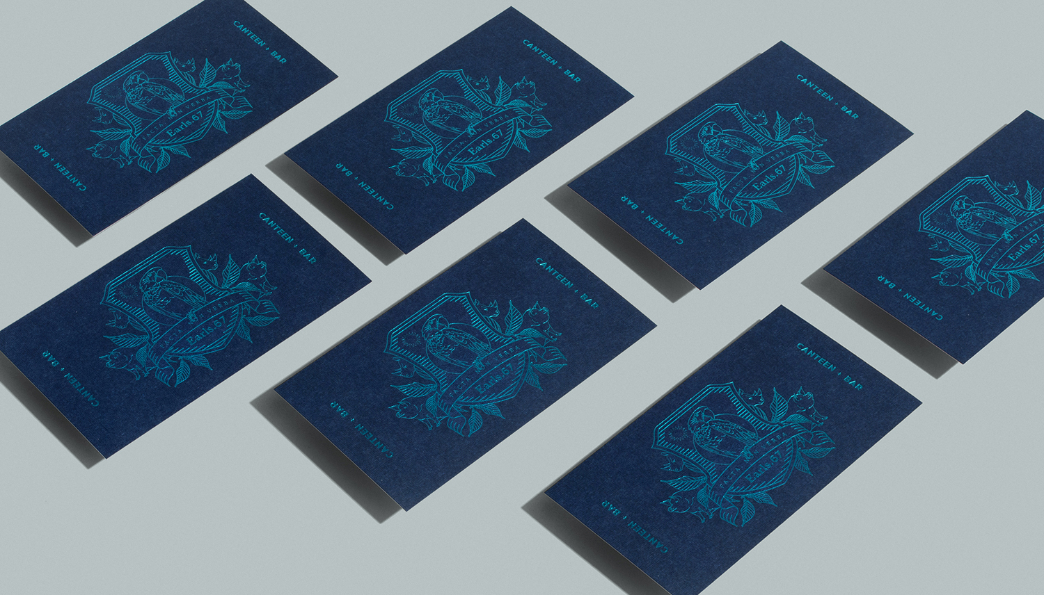 Brand identity and business cards with blue block foil print finish by Glasfurd & Walker for US and Canadian restaurant chain prototype Earls.67