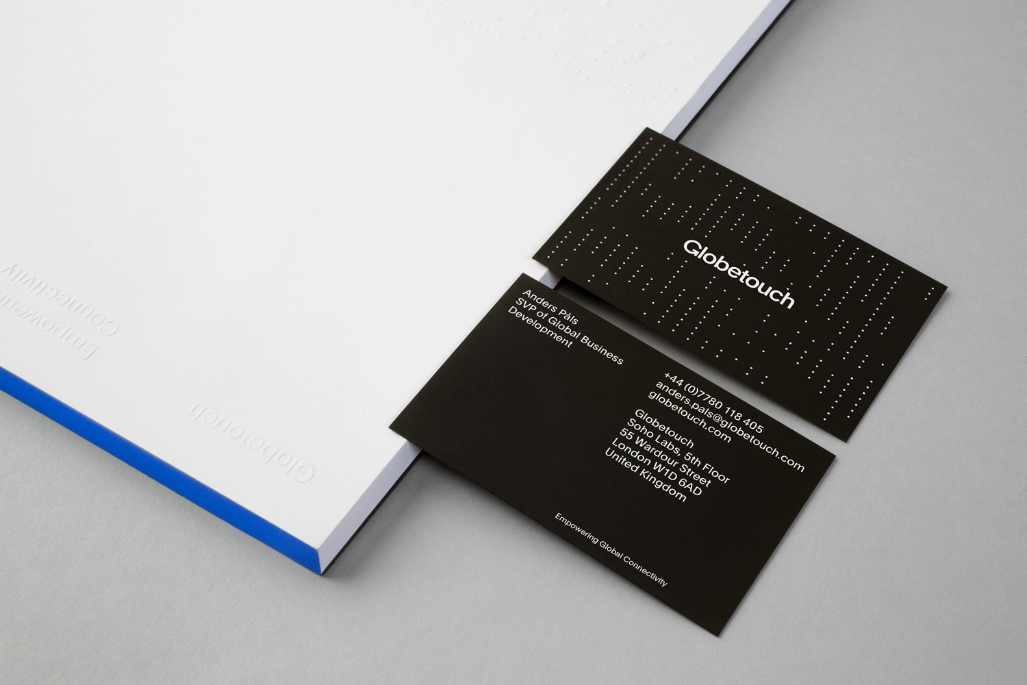 Business cards for UK communications business Globetouch designed by Bunch. These feature a white ink over a black substrate.