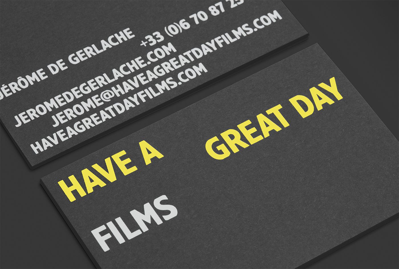 Black card and yellow and white foiled business cards for Have A Great Day Films designed by Hey