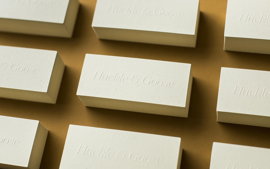 Logotype and blind embossed business card design by Cast Iron for seasonal meal advisor Huckle & Goose