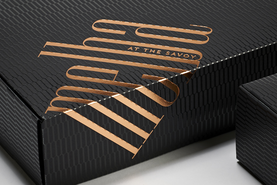 Logotype and copper foiled packaging designed by Pentagram for London patisserie and cafe Melba at The Savoy