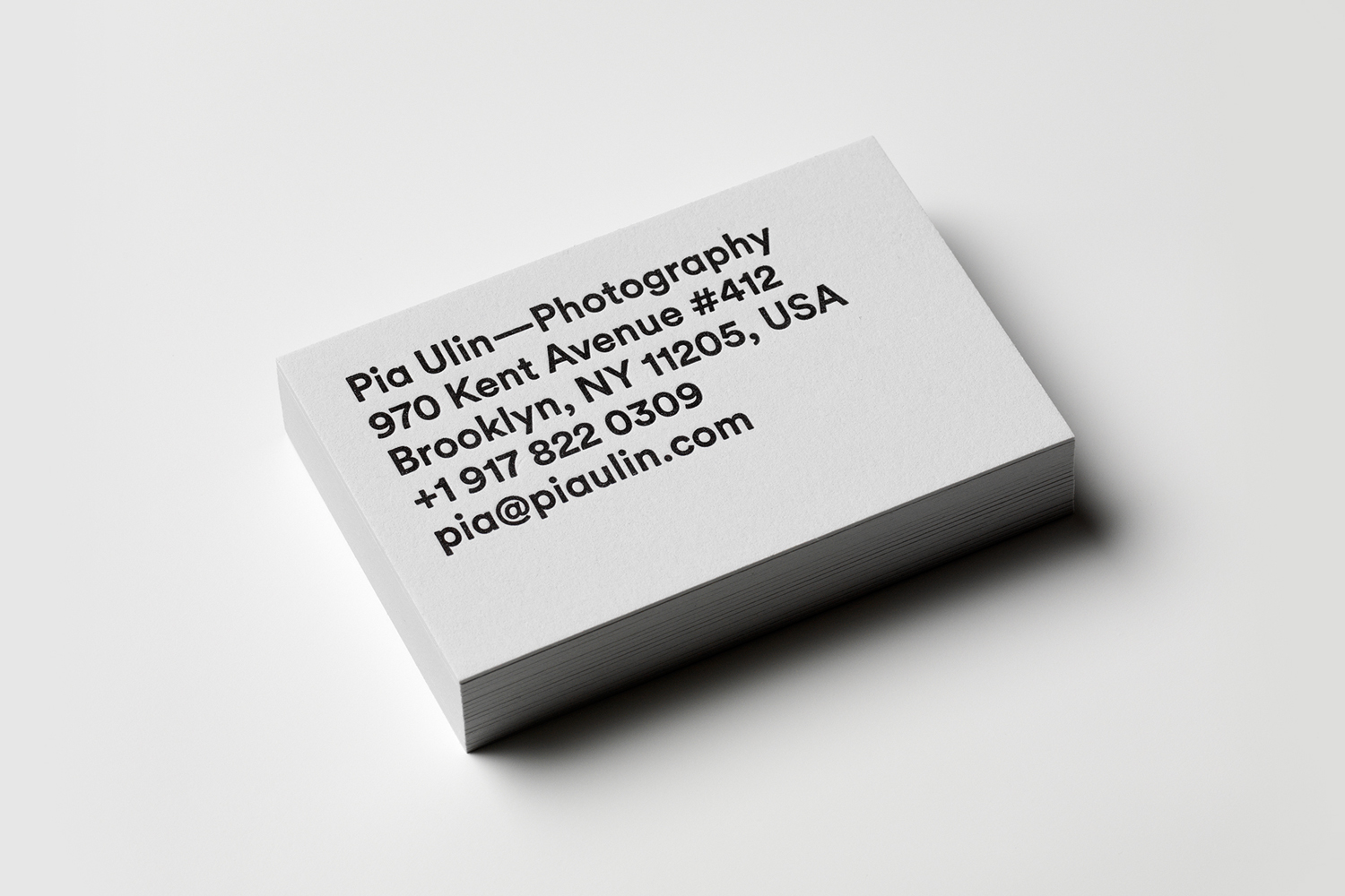 Grey board and black block foiled business card for Pia Ulin Photography designed by The Studio