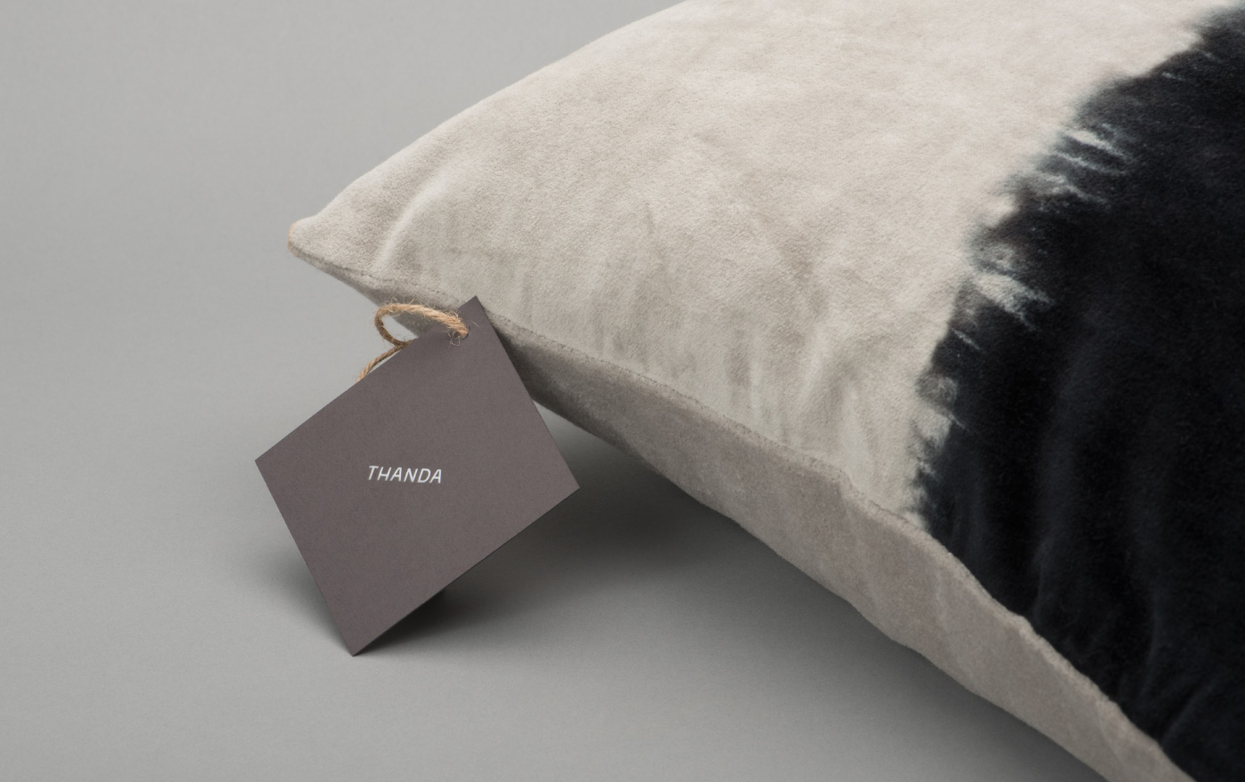 Brand identity and product tags by UK graphic design studio Karoshi for conscientious interior accessory business Thanda