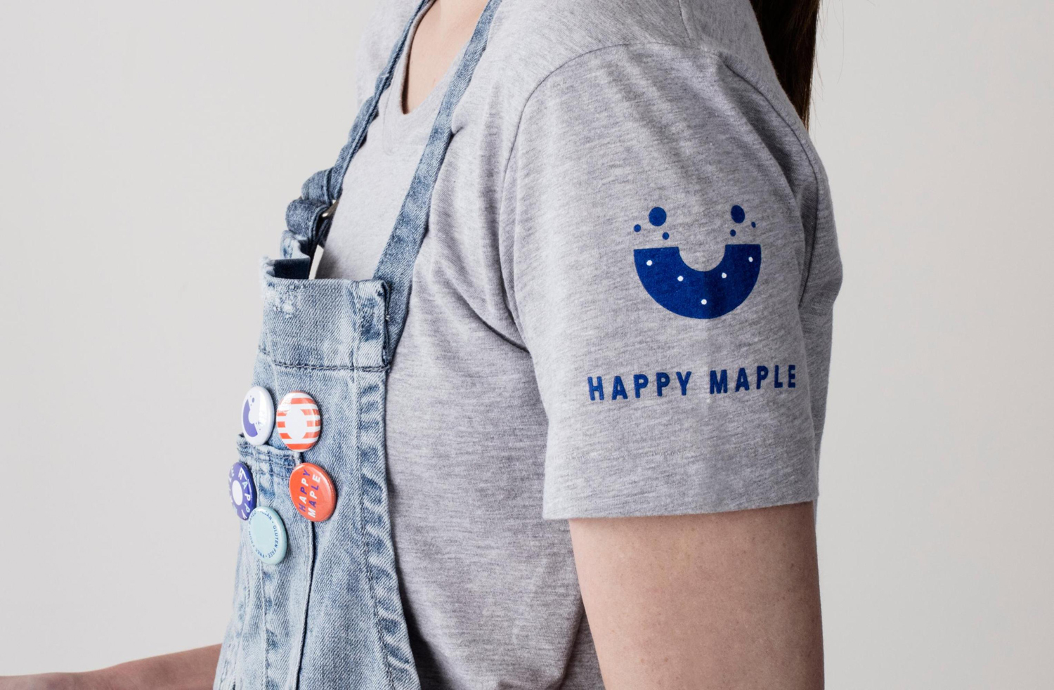 Brand identity, brand t-shirt and badges by Sydney-based graphic design studio Garbett for donut bakery Happy Maple. 