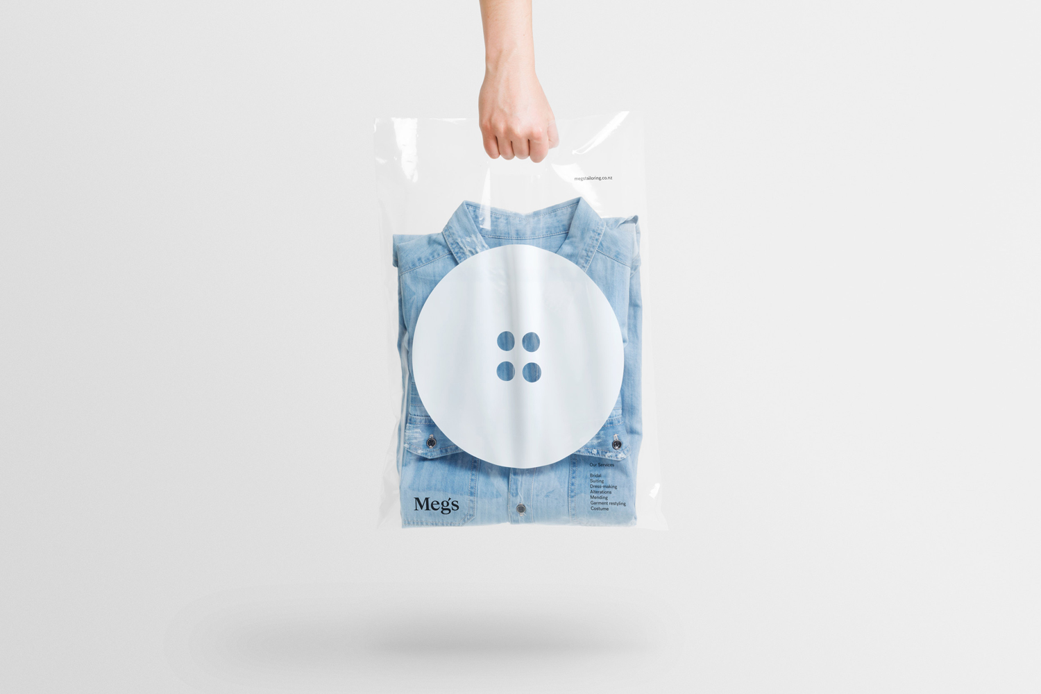 Brand identity and branded carrier bag by Auckland-based Studio South for New Zealand tailoring service Meg's