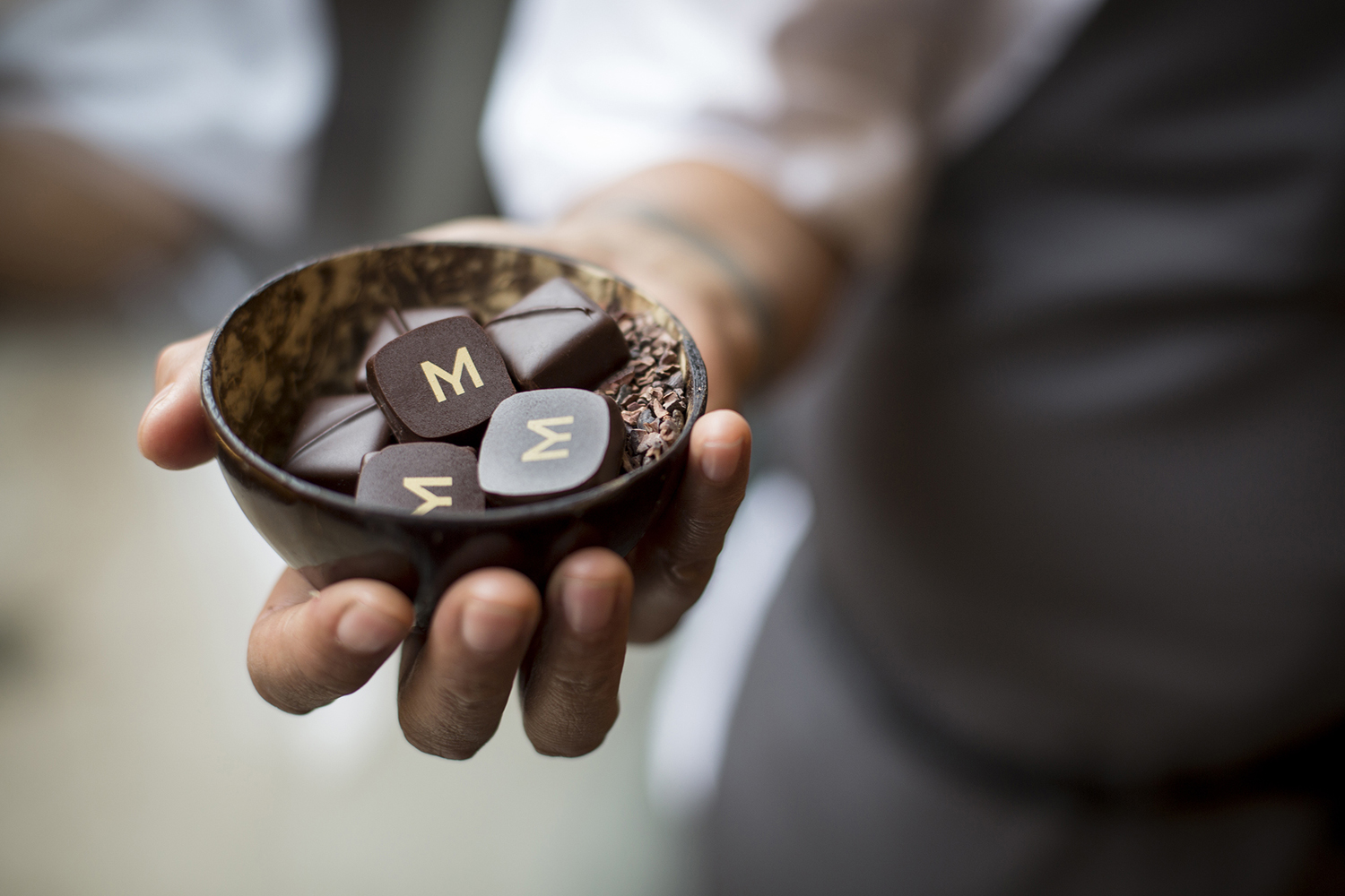 Logo and branded chocolates designed by Bibliothèque for Monica Galetti's new London restaurant Mere