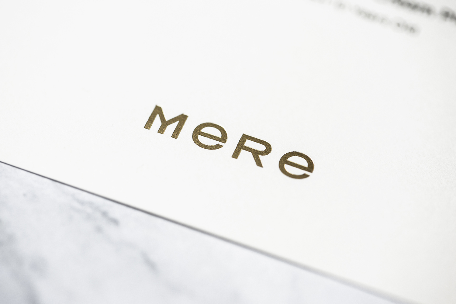 Gold block foiled logotype designed by Bibliothèque for Monica Galetti's new London restaurant Mere