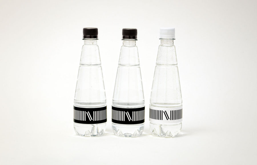 Visual identity and water packaging designed by lg2boutique for Quebec City delicatessen Nourcy