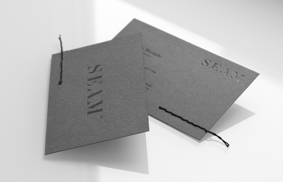 Business cards with black foil and stitched detail by For Brands for luxury clothing distributor Seam