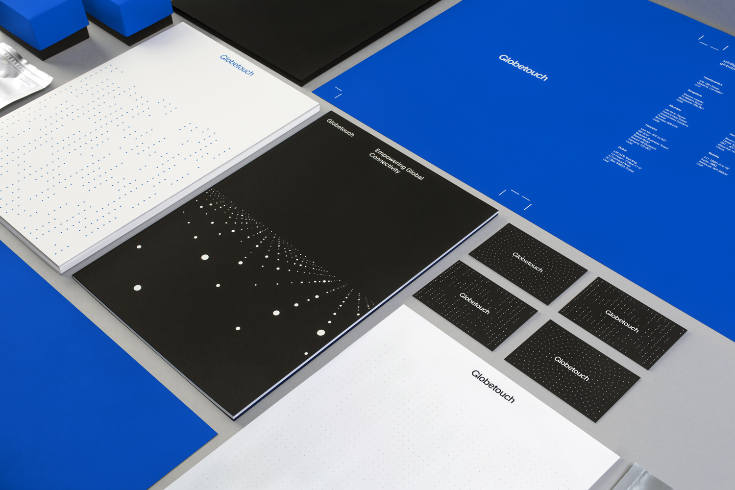 Brand identity, stationery and print communication for global mobile communications platform Globetouch by graphic designs studio Bunch