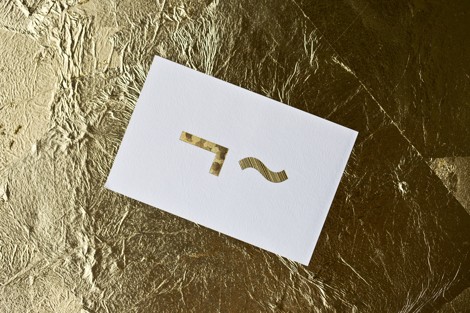 Logo and business cards with gold foil and embossed detail for UK model agency Linden Staub by Bibliothèque.