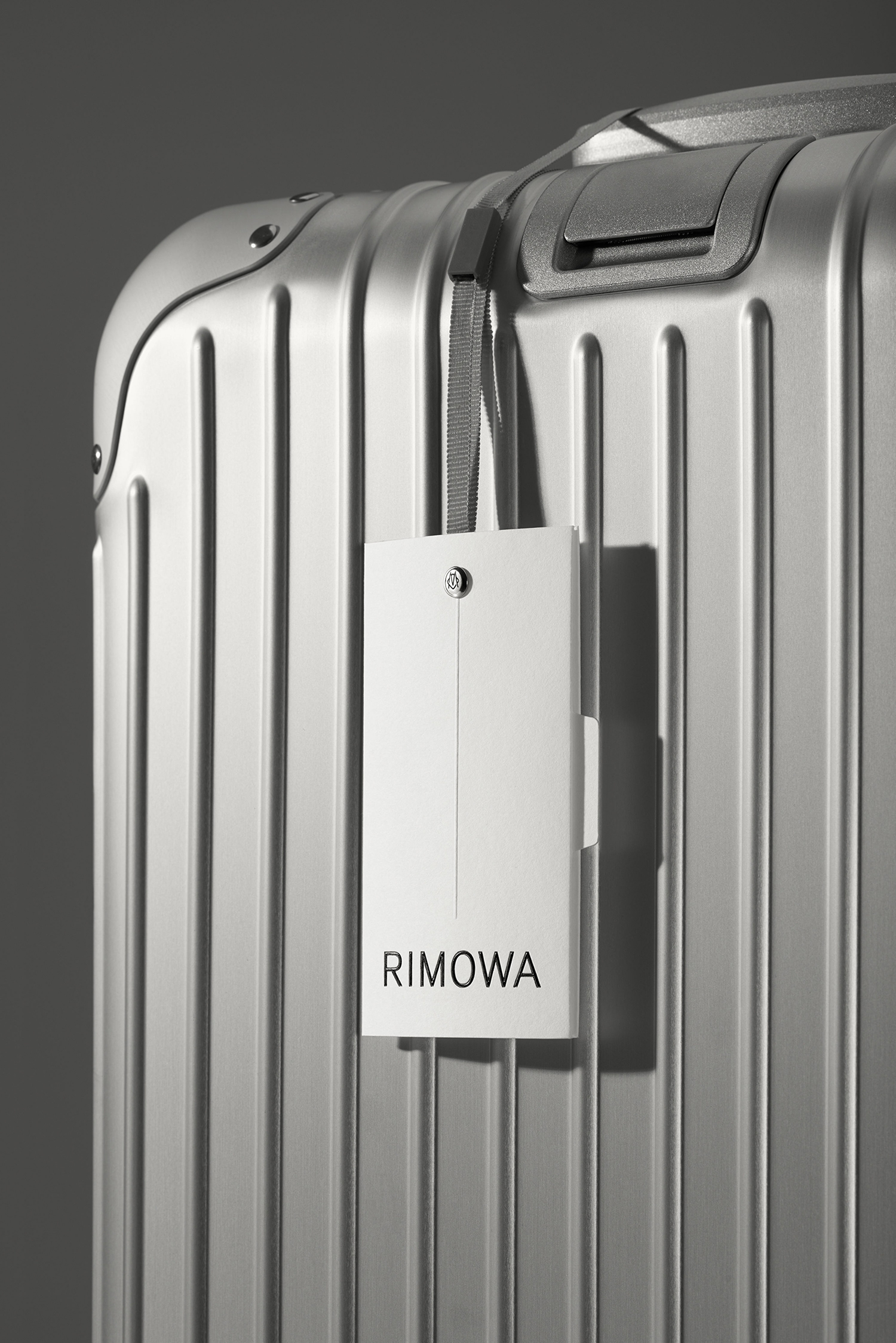 Monogram, type style, pattern and packaging by designed by Commission studio for functional luxury luggage manufacturer Rimowa