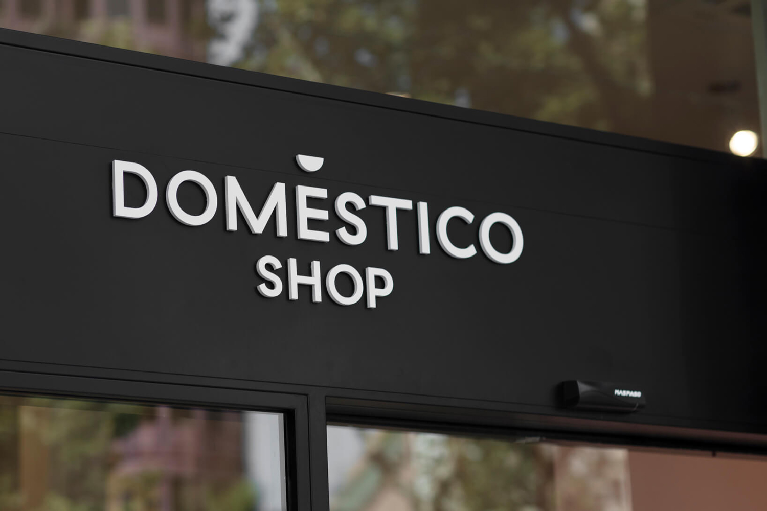 Logotype and signage designed by Mucho for Spanish furniture retailer DomésticoShop