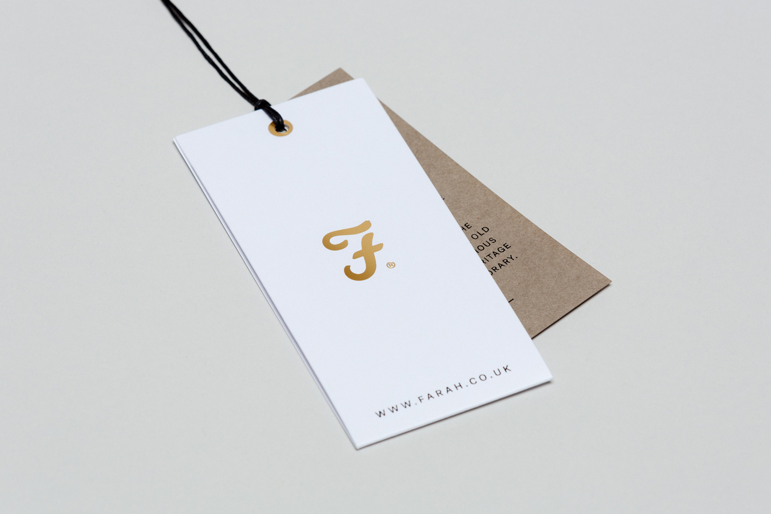 Brand identity and gold block foil clothing tag for British fashion brand Farah by graphic design studio Post