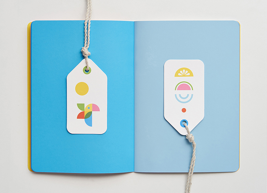Coloured paper notebook and luggage tags for Investec 2014 Conference by Garbett