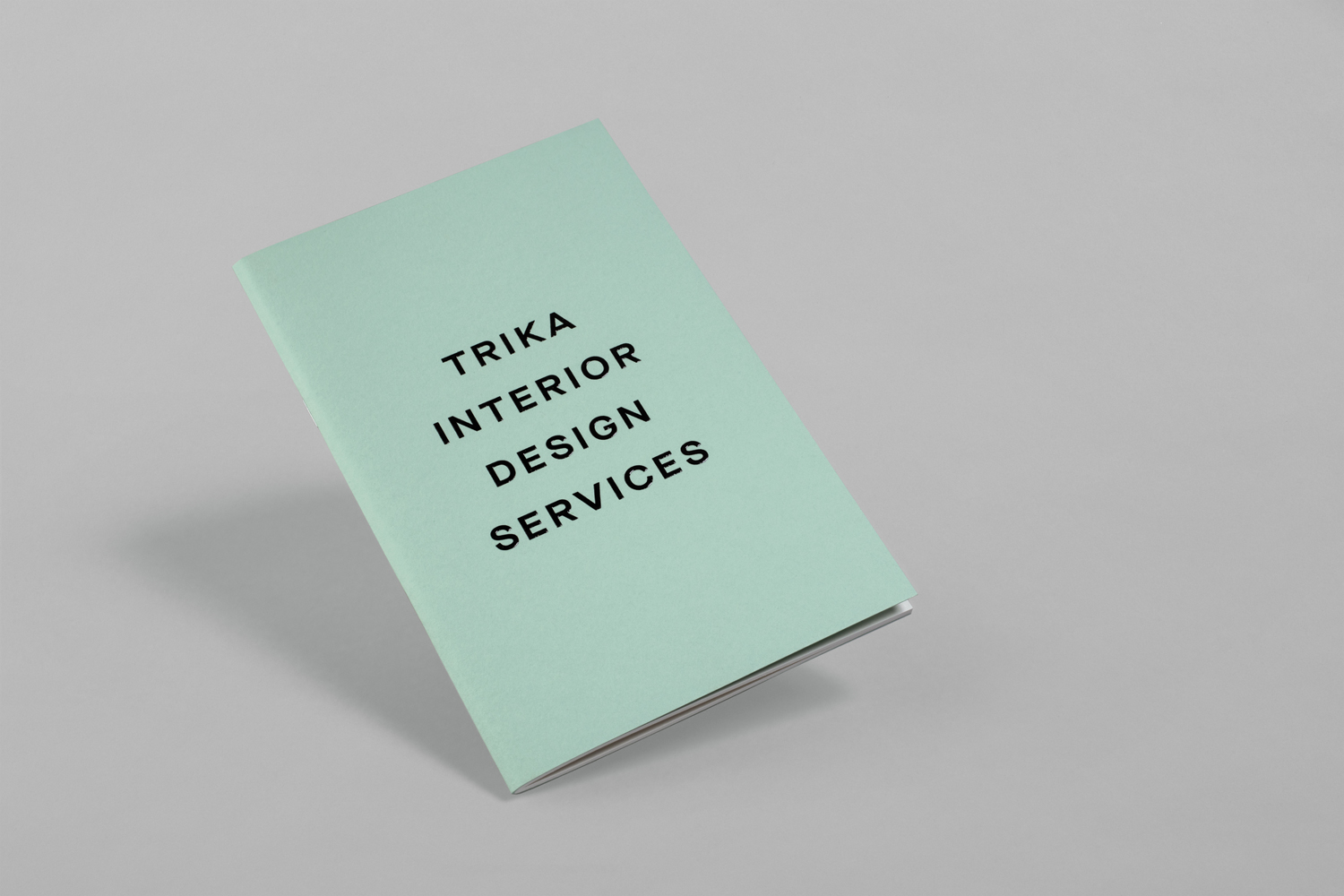 Brand identity and notebook with a thermographic ink print finish by UK design studio Bunch for Croatian interior design business Trika
