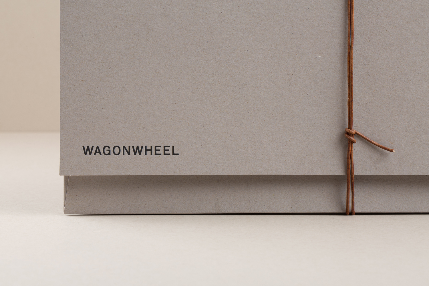 Brand identity and folder with black block foil print finish for Nashville-based boutique real estate title and escrow company Wagon Wheel designed by Perky Bros.
