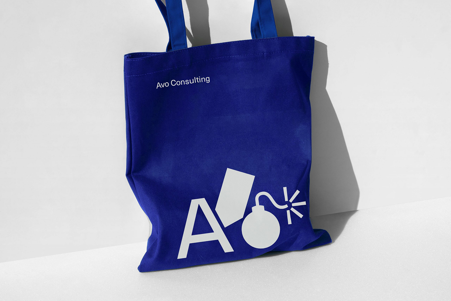 New logo, custom typeface, posters, banners, supergraphics and tote bags for Nordic technology and management consultancy Avo designed by Blee