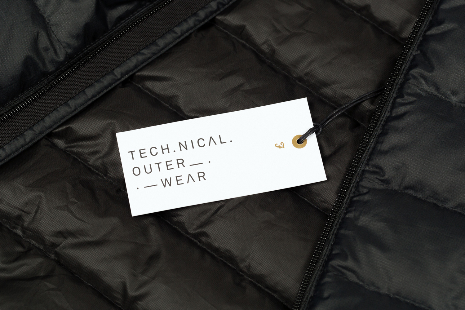 Brand identity and clothing tag with gold ink detail for British fashion brand Farah by graphic design studio Post