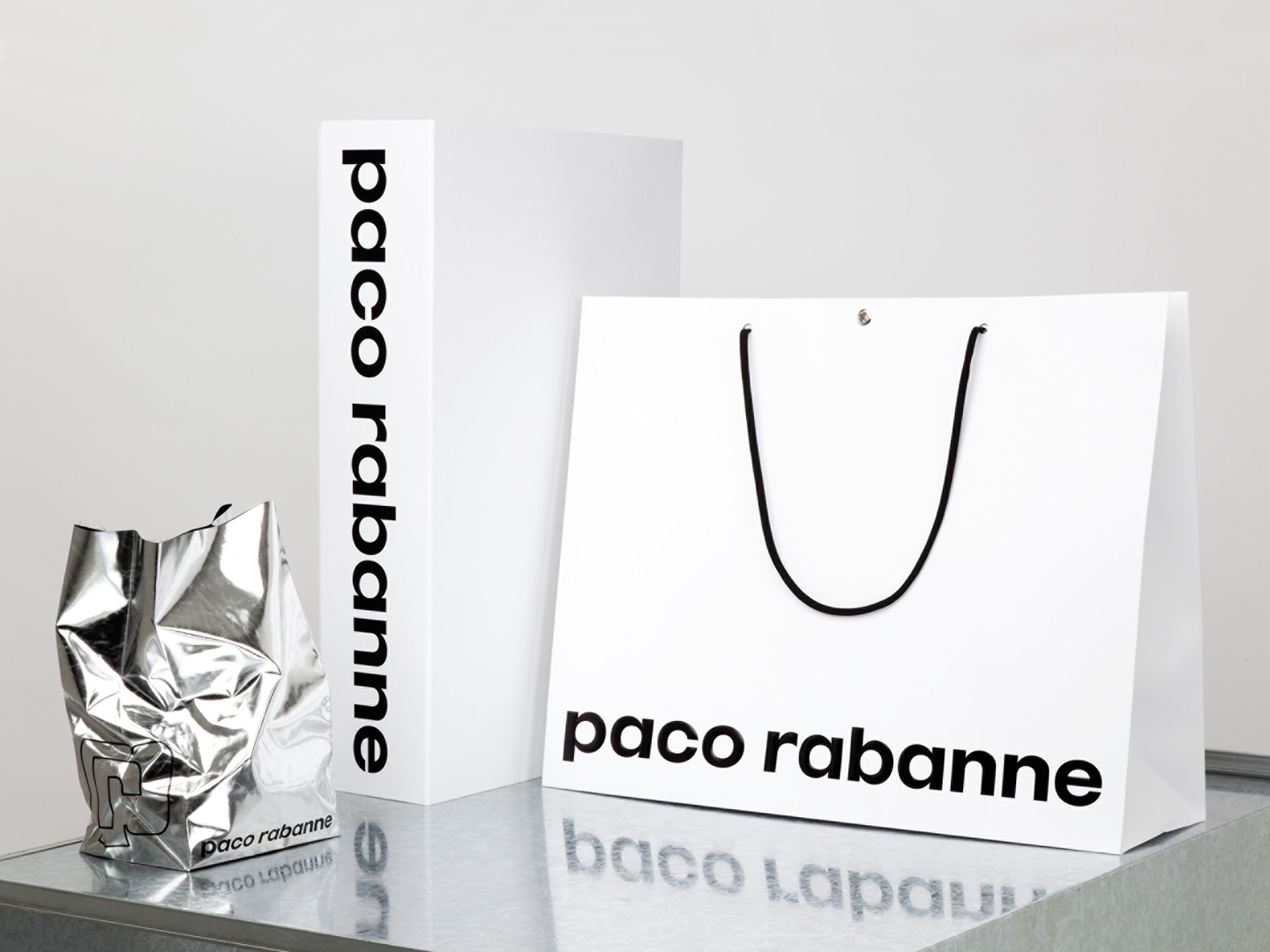 Brand book, brand identity and shopping bags for French fashion label Paco Rabanne by Zak Group, United Kingdom