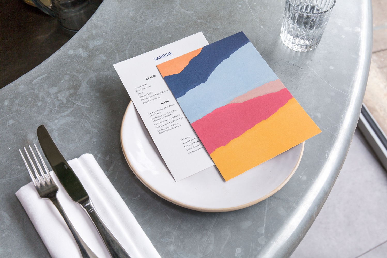 Logo, menus and signage by British studio Here Design for London-based Southern French and Mediterranean food restaurant Sardine