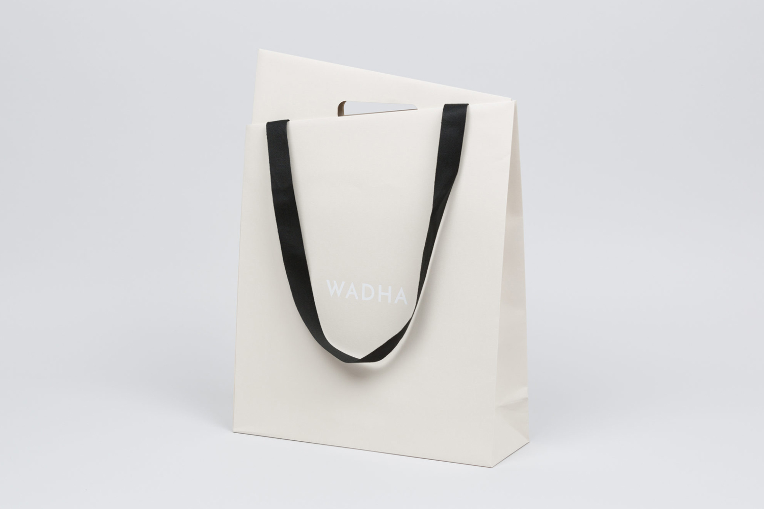 Brand identity and bag for Doha, Qatar, based fashion brand Wadha by Two Times Elliott, United Kingdom