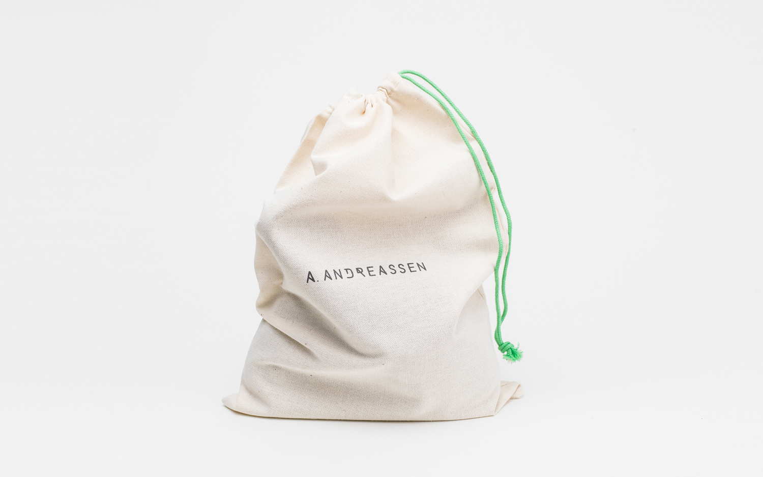 Brand identity and branded draw string bag by graphic design studio Bond for new Scandinavian lifestyle brand A. Andreassen