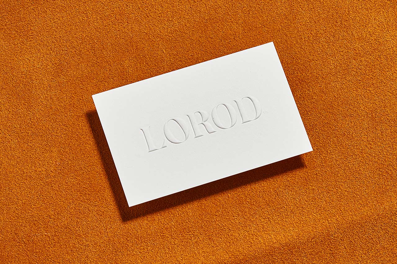 Brand identity and blind embossed business card by Pentagram's Natasha Jen for fashion brand Lorod. 