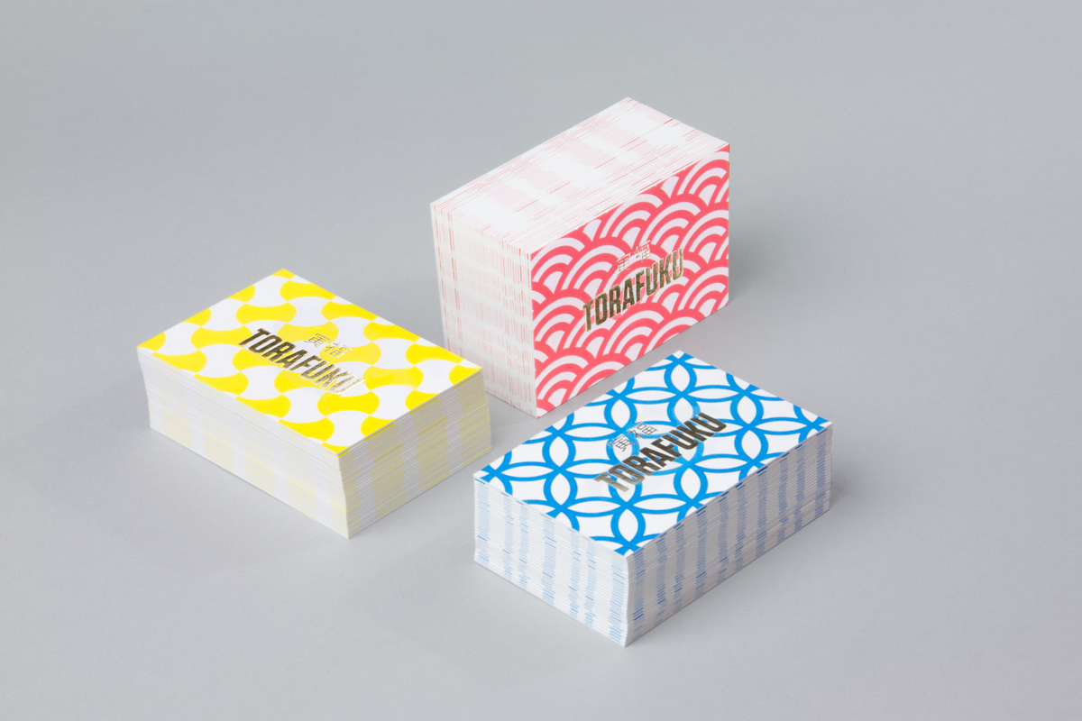 Gold of business cards for contemporary pan Asian restaurant Torafuku by graphic design studio Brief