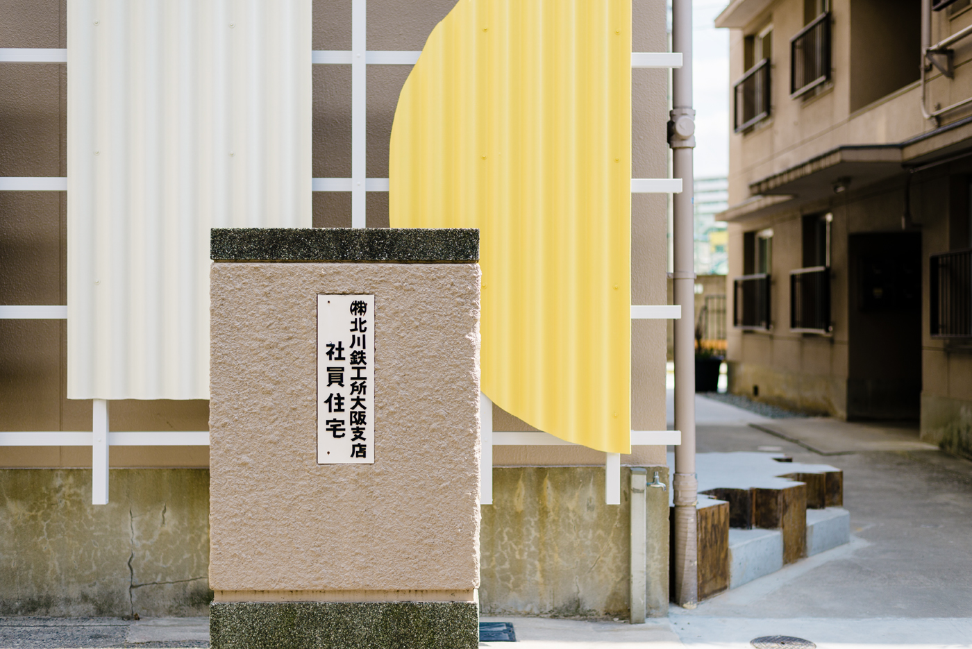 Wordmark, signage and facade by UMA for property development APartMENT in the new creative hub of Osaka's Kitakagaya area