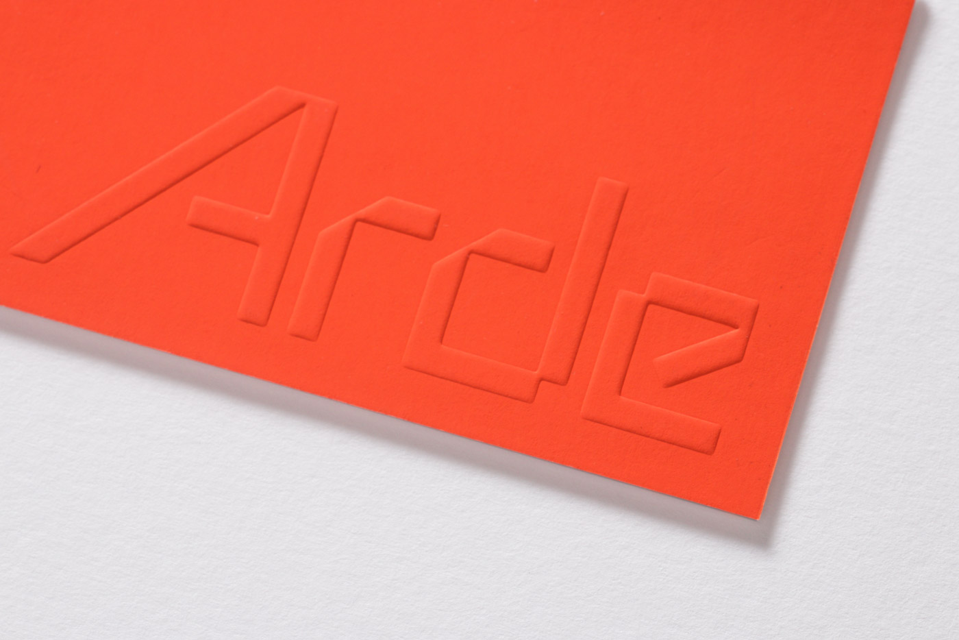Logotype and blind embossed business card for Lima-based architecture and design firm Arde by IS Creative Studio, Peru
