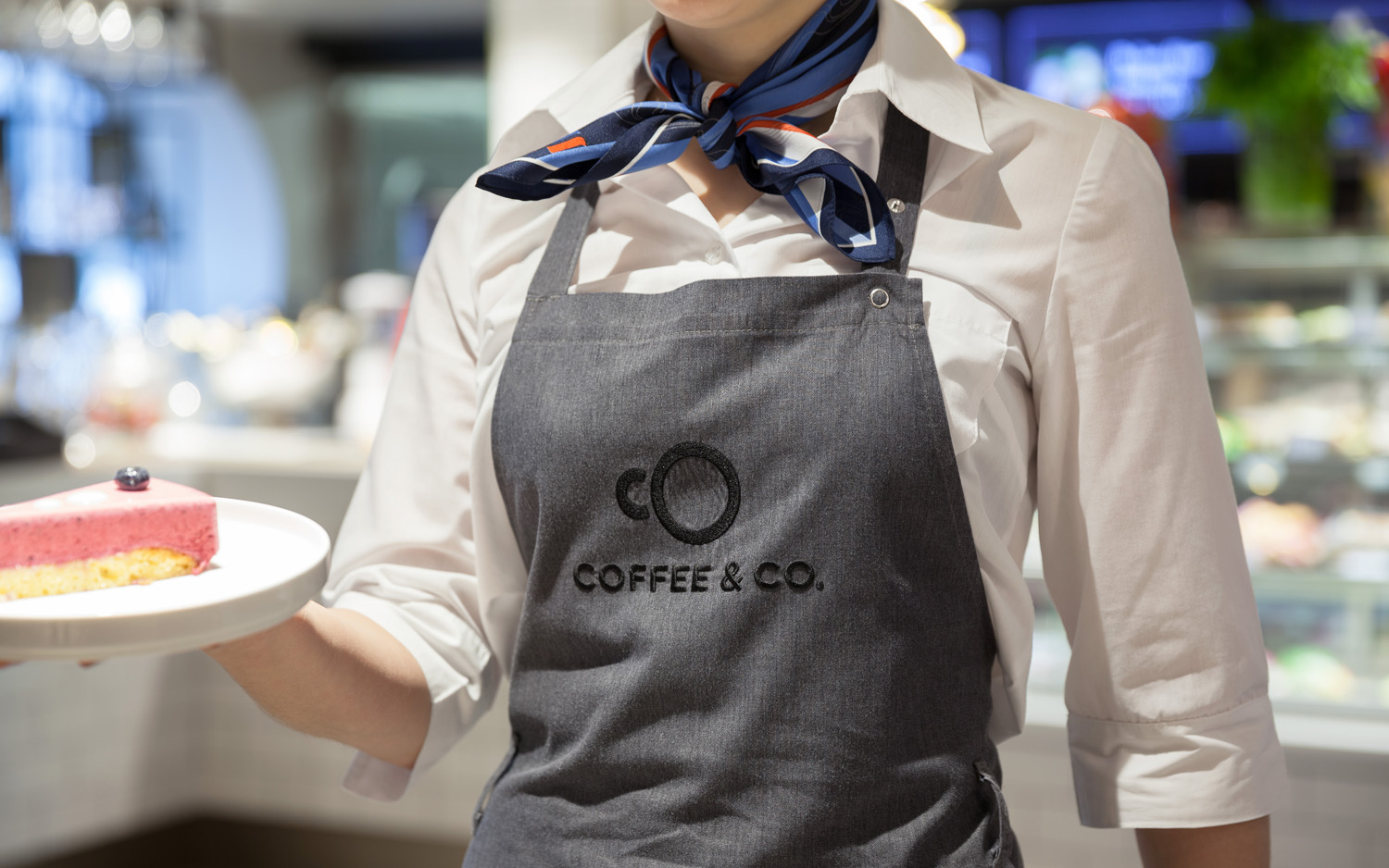 Brand identity and branded apron by Bond for cruise ship cafeteria concept Coffee & Co. 