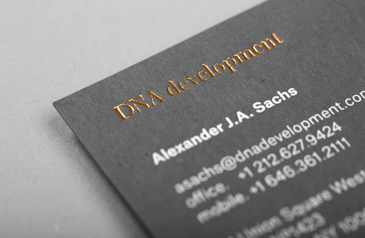 Brand identity, white and copper foil business cards for real estate investment and development business DNA development by Face