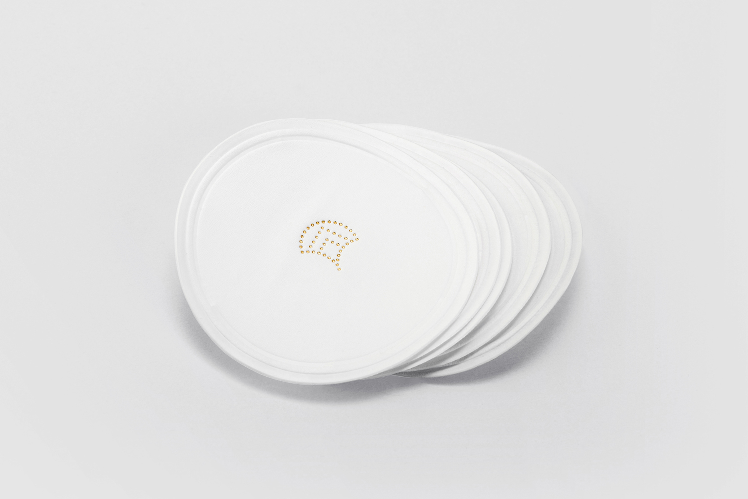 Blind embossed and gold foiled coasters by London-based studio Two Times Elliott for Soho members bar Disrepute