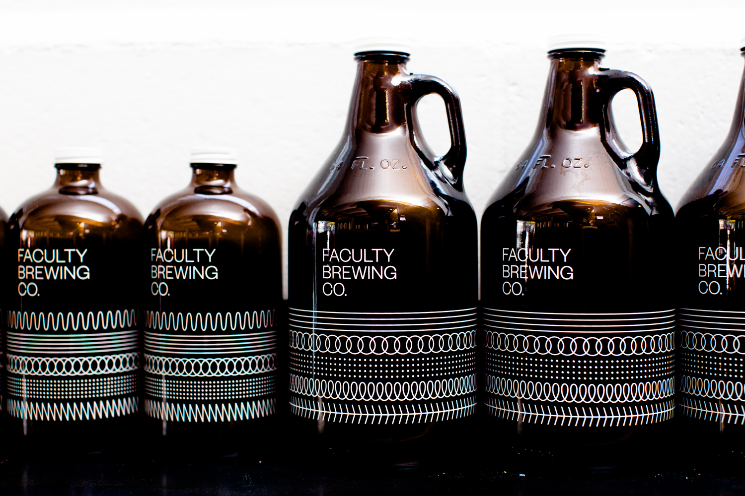 Logotype and screen printed growlers by Canadian graphic design studio Post Projects for Faculty Brewing Co. 