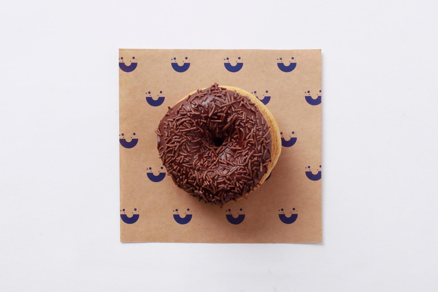 Branding and branded napkins by Sydney-based graphic design studio Garbett for donut bakery Happy Maple. 