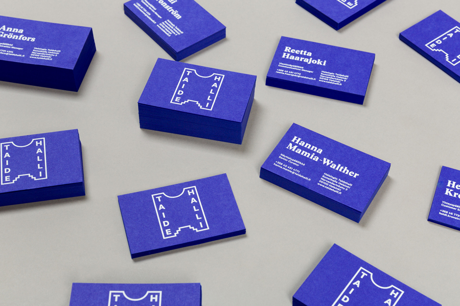 Blue board business cards with white ink detail for Taidehalli designed by Tsto