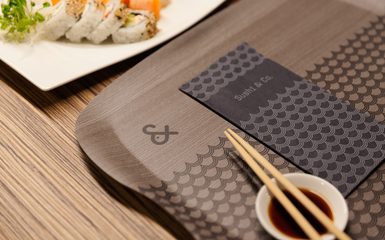 Visual identity, napkins and trays for cruise ship restaurant Sushi & Co. designed by Bond
