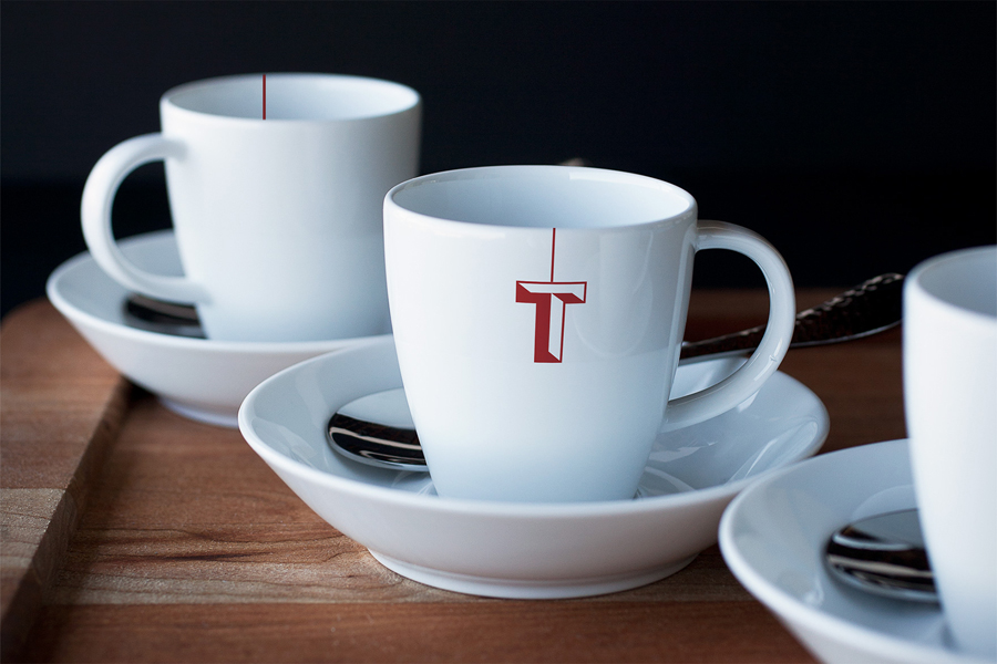 Brand identity, branded cups for Tenderloin Museum by graphic design studio Mucho