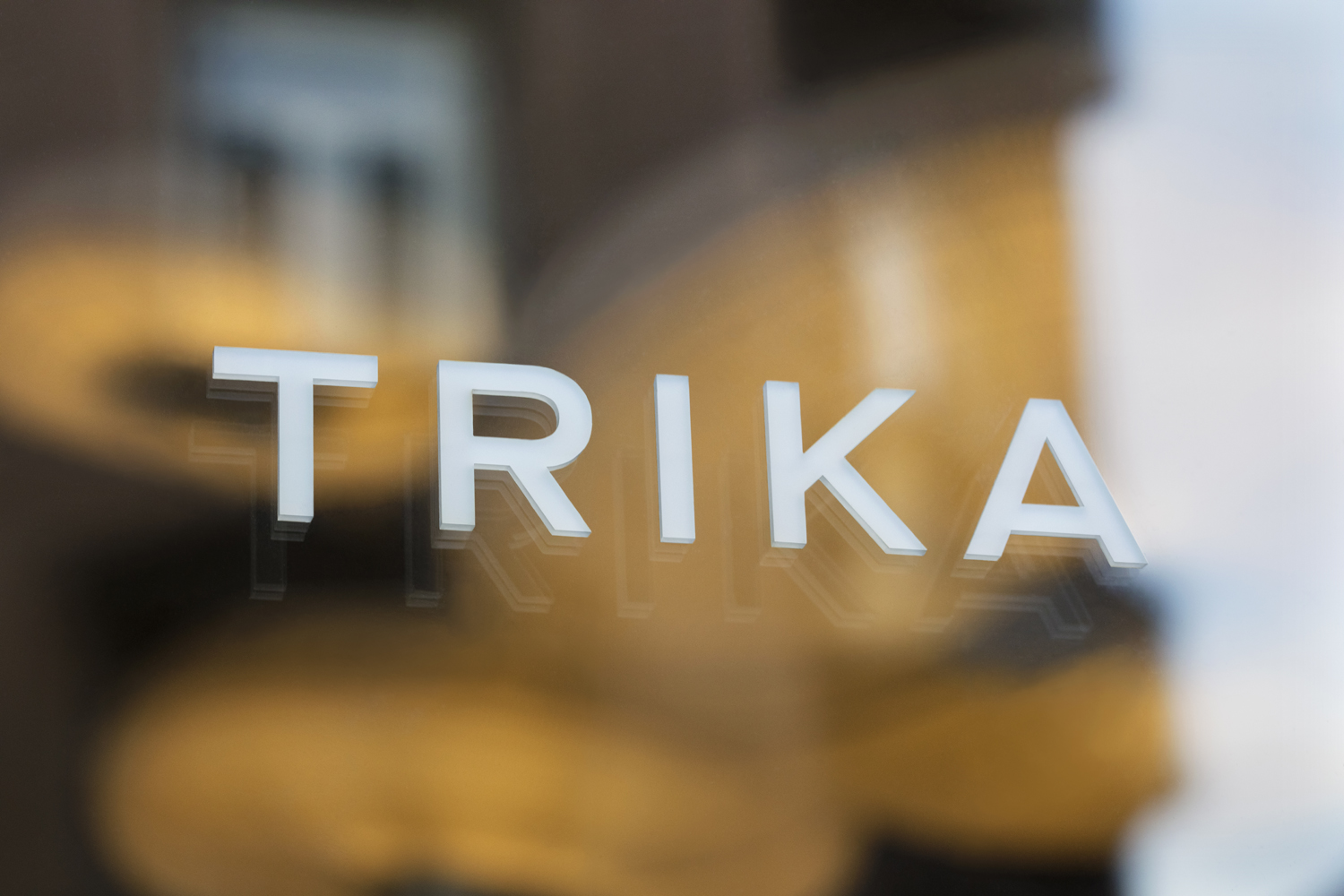 Logotype as signage by UK design studio Bunch for Croatian interior design business Trika